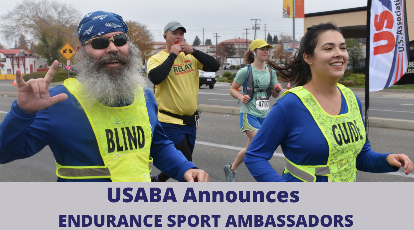 Rob Sanchas runs alongside his guide at the 2021 USABA Marathon National Championships