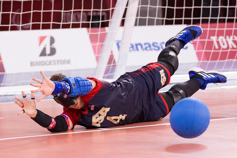 Asya Miller dives to her left to block a goalball during the Tokyo Paralympic Games in 2021.