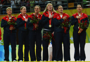 U.S. team players celebrate on the podium after winning the gold medal in the women goalball match at the Beijing Institute of Technology Gymnasium during day eight of the 2008 Paralympic Games September 14, 2008 in Beijing, China. (Photo by Guang Niu/Getty Images)