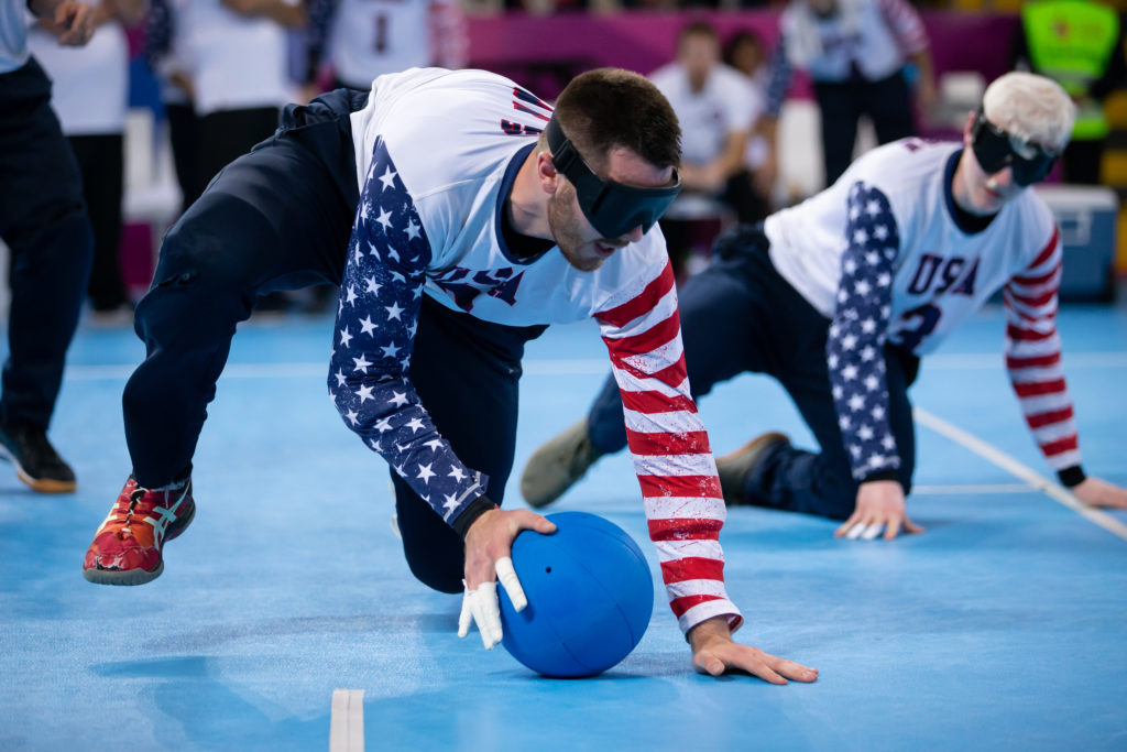 Calahan Young gathers in the goalball after making a stop during the 2019 Parapan American Games in Lima, Peru.