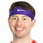 A headshot photo of Calahan Young wearing a purple Nike headband