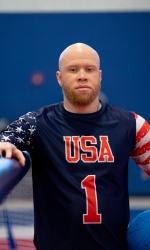 A headshot photo of Daryl Walker wearing a blue #1 USA jersey.