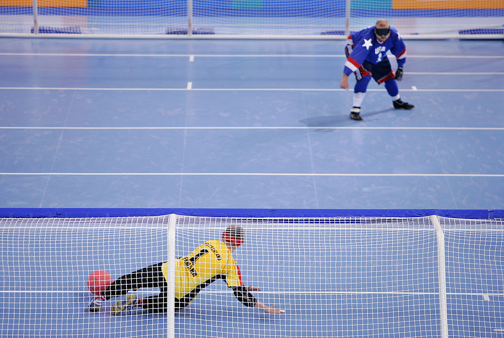 John Mulhern takes a penalty throw toward a German defender.