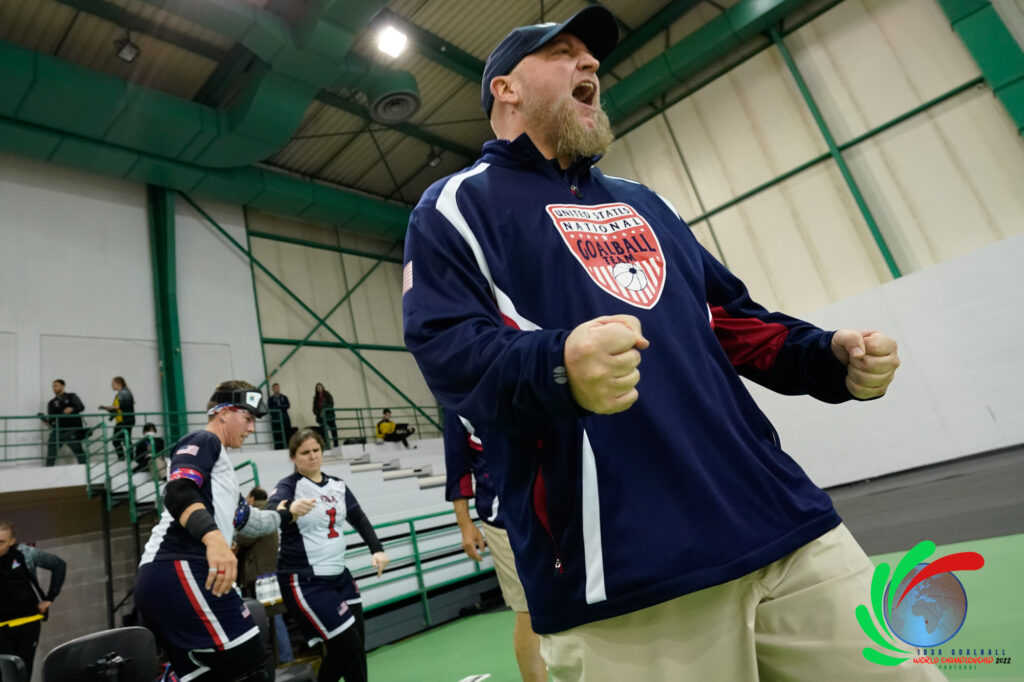 USA Women's Goalball Coach Jake Czechowski reacts to the play on the court.