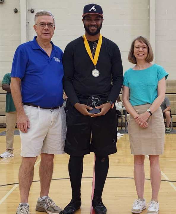 Kaijain Sheppard receives his MVP award on the court