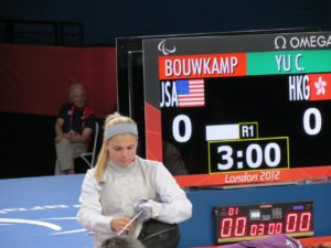 Cat Bouwkamp adjusts her equipment during the wheelchair fending competition at the 2012 London Paralympic Games