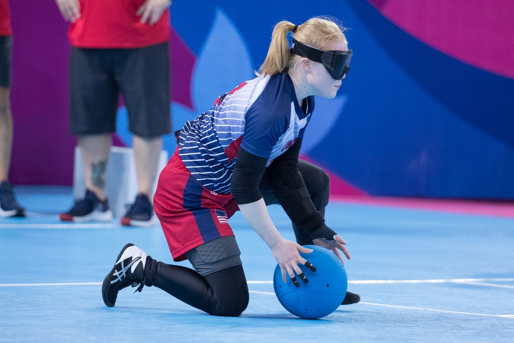 Marybai Huking kneels on her right knee as she gathers in the goalball during the 2019 Parapan American Games in Lima, Peru.