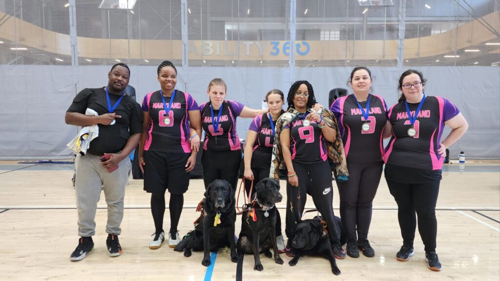 Gold-medal-winning Maryland Minks (l to r): Coach Kelvin Atkinson, Shavon Lockhardt, Bridget Cassidy, Breanna Pumphrey, Rebecca Levasseur, Makalia Lama and Tori Bounds