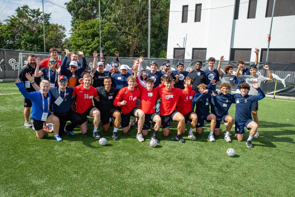 USA Blind Soccer athletes and coaches pose with members of the soccer teams from Barry University and Christopher Columbus High School after they helped run the blind soccer clinics in Miami on February 24, 2024.