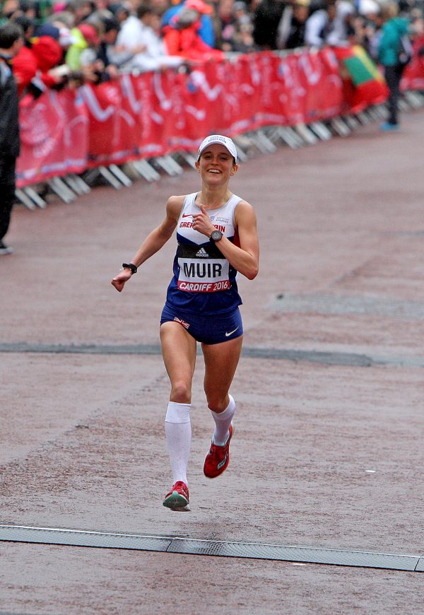 Tina Muir smiles as she sprints to the finish line of the 2016 World Half Marathon Championships