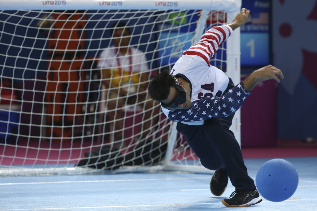 Tyler Merren follows through on a throw during a goalball match at the 2019 Parapan American Games in Lima, Peru. (photo by Lima 2019)