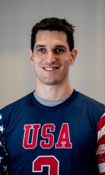 A headshot photo of Tyler Merren wearing a blue #2 USA jersey.