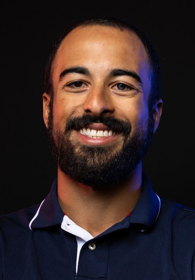 Headshot photo of a smiling Zach Buhler